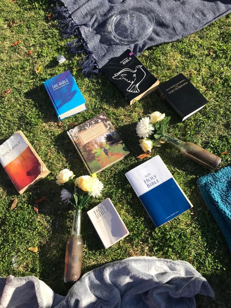 Bibles laid out on a picnic blanket